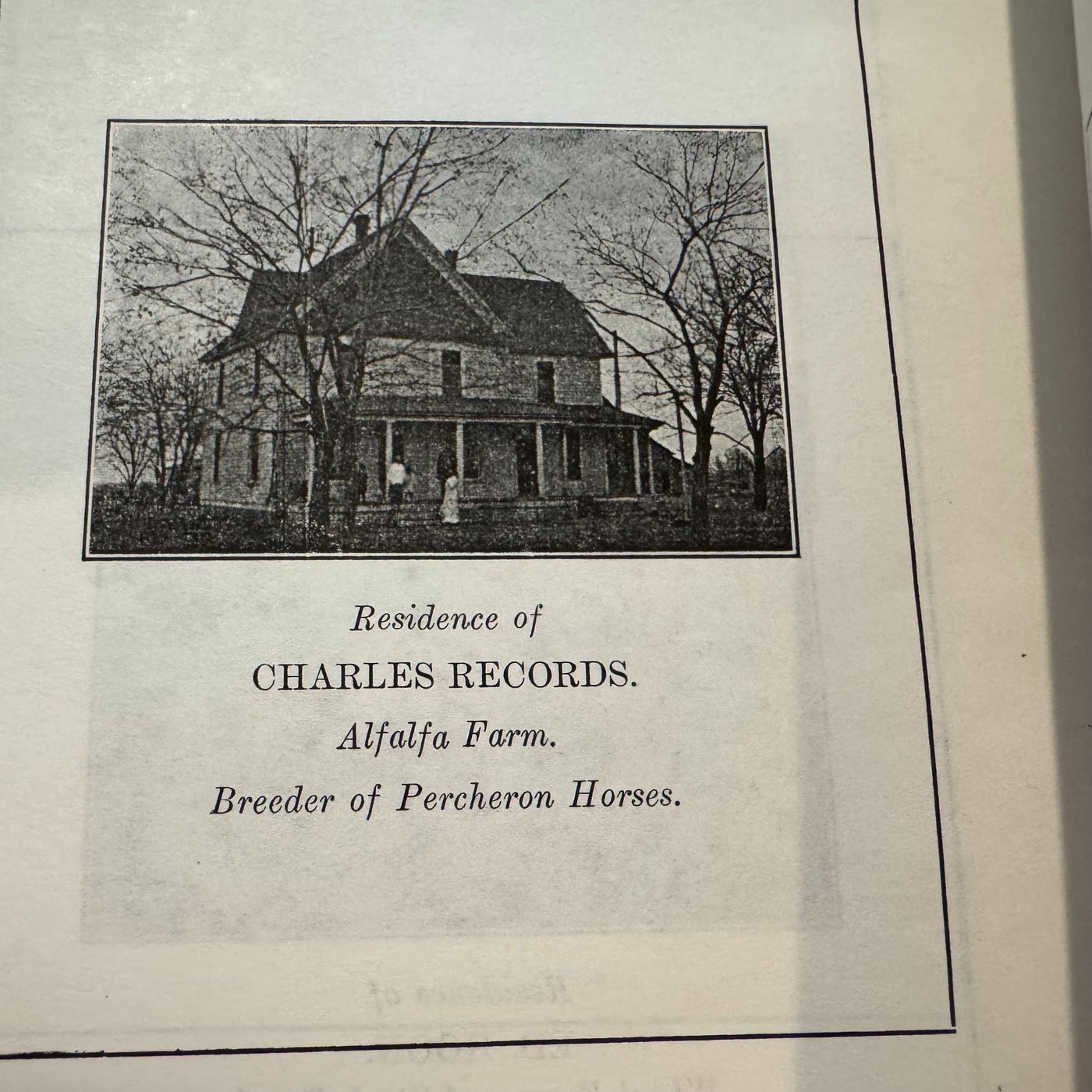 A two-story farmhouse framed by bare trees; the printed caption reads &ldquo;Residence of Charles Records.&rdquo;